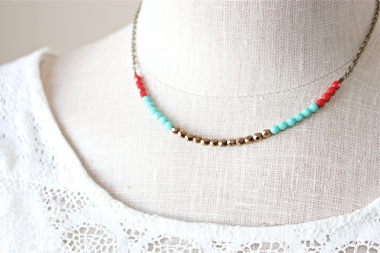 Multi color Czech glass beaded necklace.  Golden bronze turquoise and red petite beads.