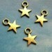 20 tiny solid star charms, gold tone, 12mm