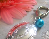 Locket, oval, bouquet charm, zipper pull, key chain.