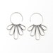 Elegant silver earrings with feather shapes soldered together to a hoop to make a modern piece of jewelry - "Peacock Hoop Earrings"