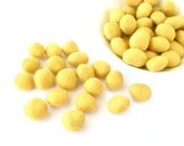 Mix of 30 yellow mellow felted wool rondelle beads / pebbles. Perfect for decorating