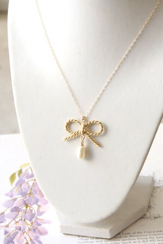 Gold bow and pearl necklace - long dangle necklace