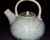 Turquoise Crystalline and Black Glazed Art Nouveau Lady Holding Lily Stamped Porcelain Teapot