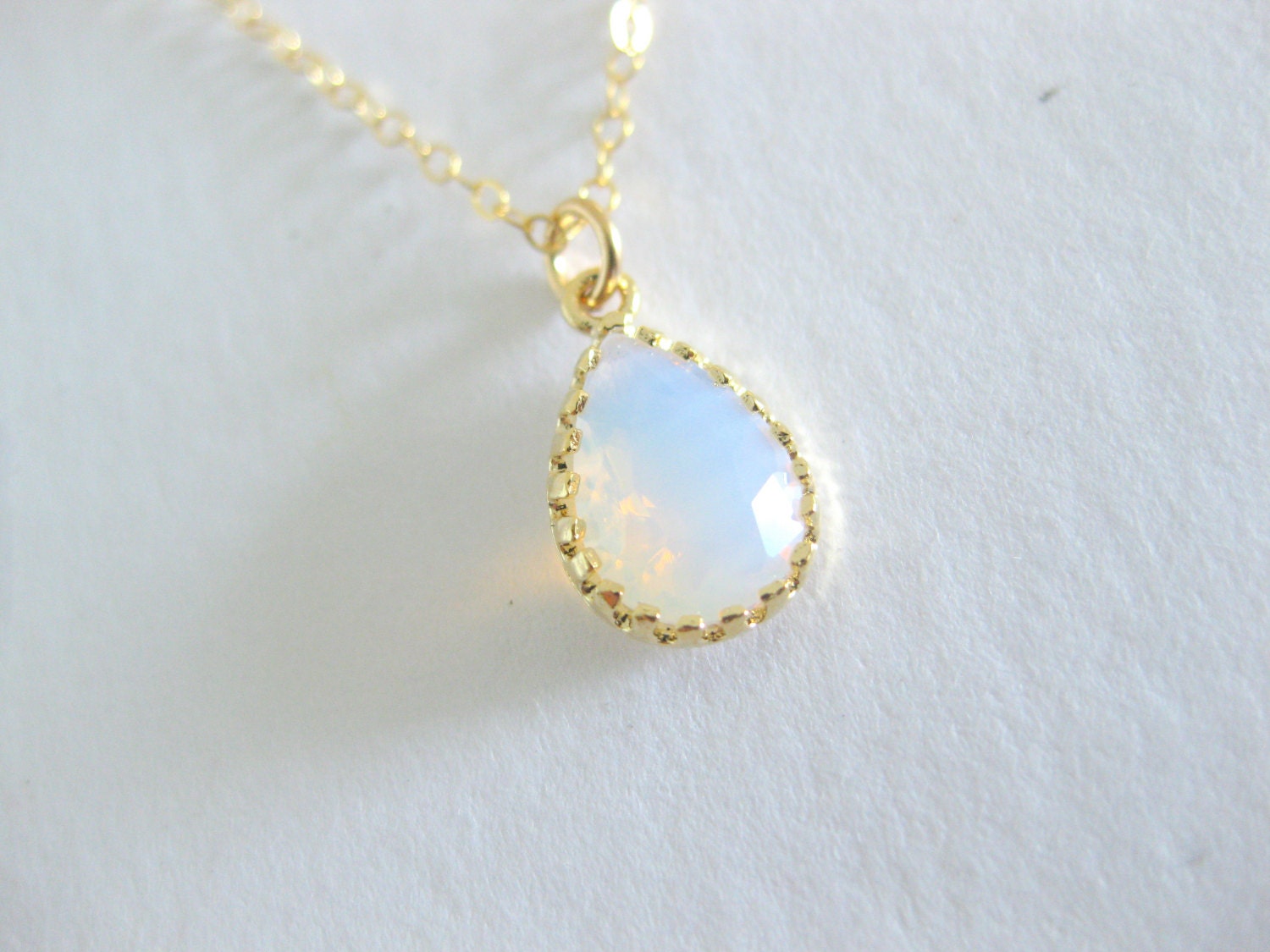 Sweet and dainty white opal glass teardrop pendant necklace. Simple and elegant bridesmaids gift.