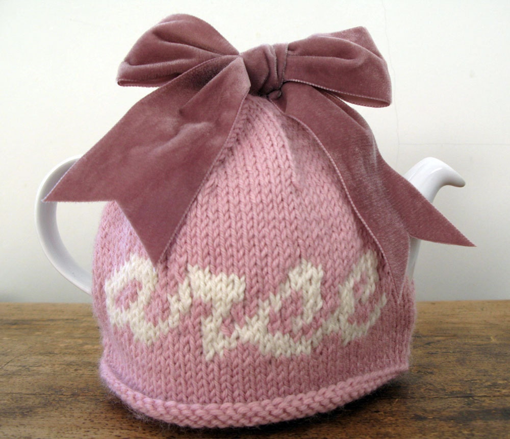 Rude "arse" pink wool tea cosy