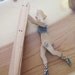 vintage wooden girl on trapeez folk art toy.