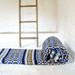 Vintage hand loomed Mexican wool blanket in royal blue with yellow stripe