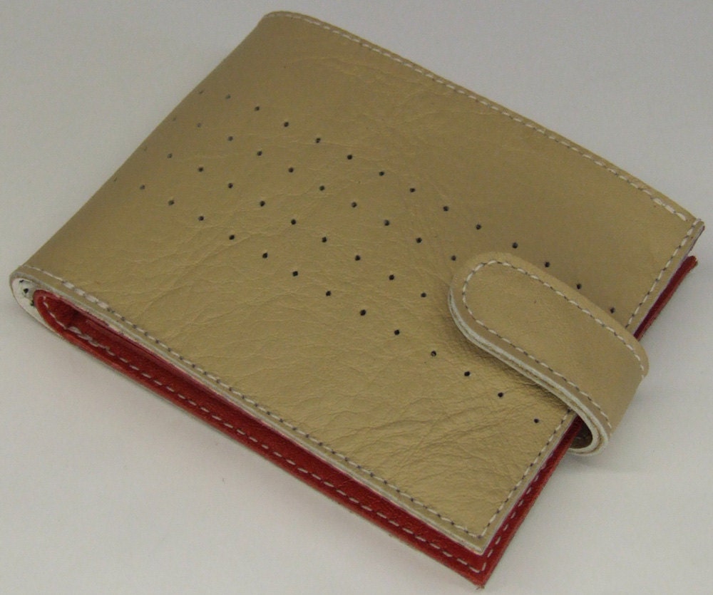 Cream leather purse with red inside