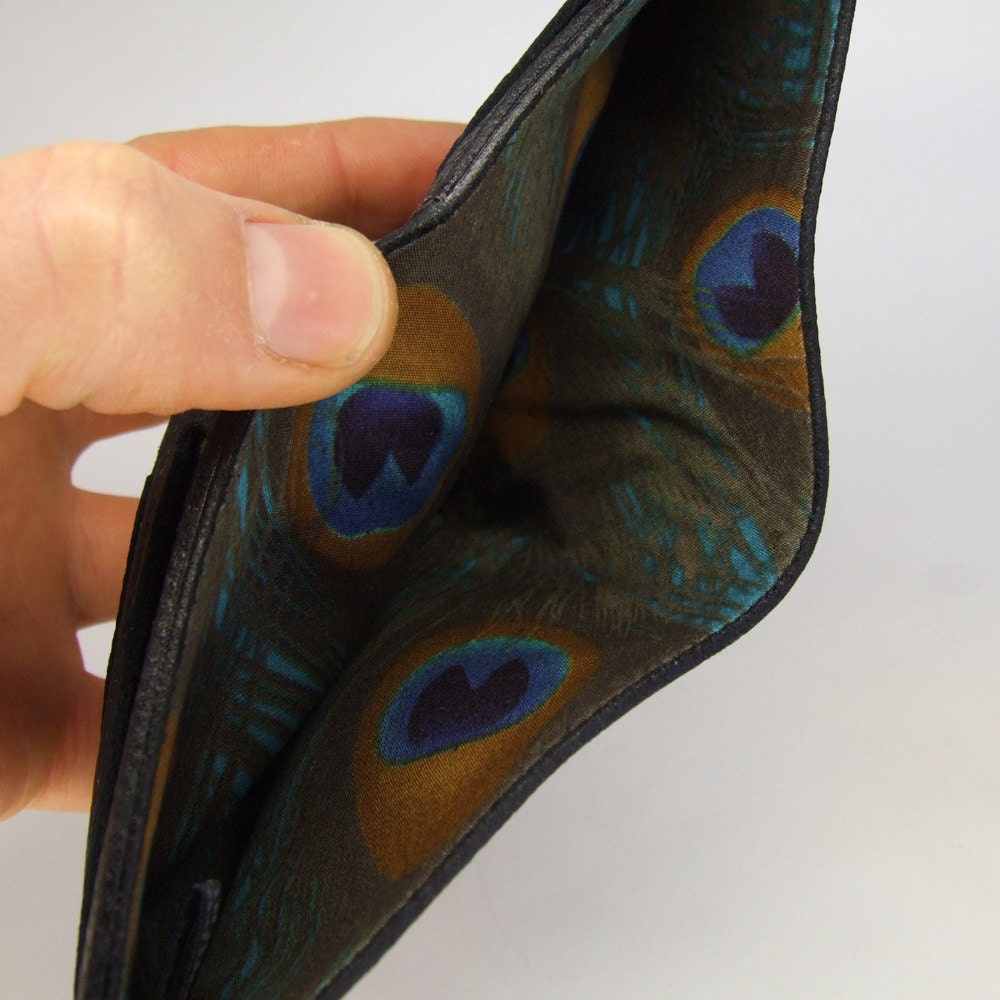 Black leather wallet with peacock feather print lining