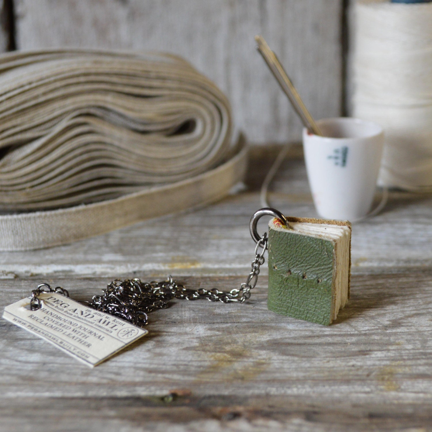 Book Necklace: Medium, green bit of sofa, reclaimed leather.