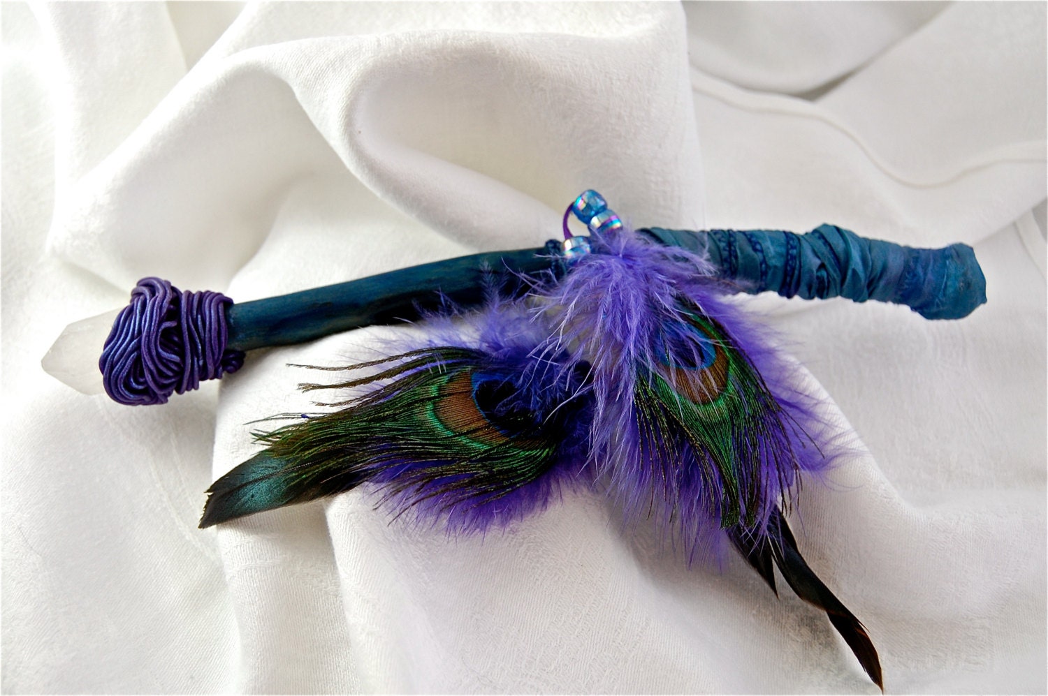 Hand finished magic wand with clear quartz and peacock feathers