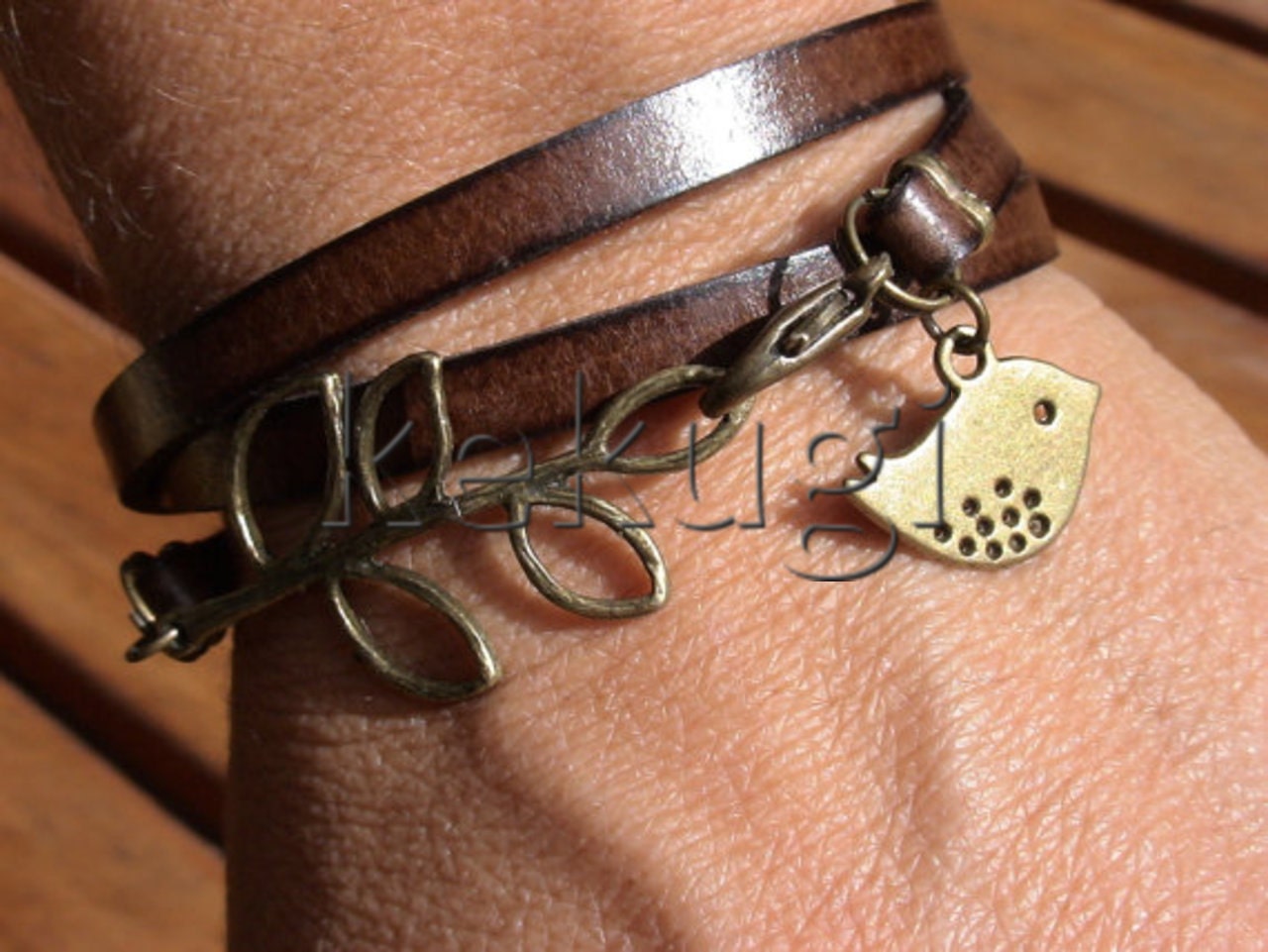 multi wrap dark brown togo flat leather bracelet with brass leaf connector and bird