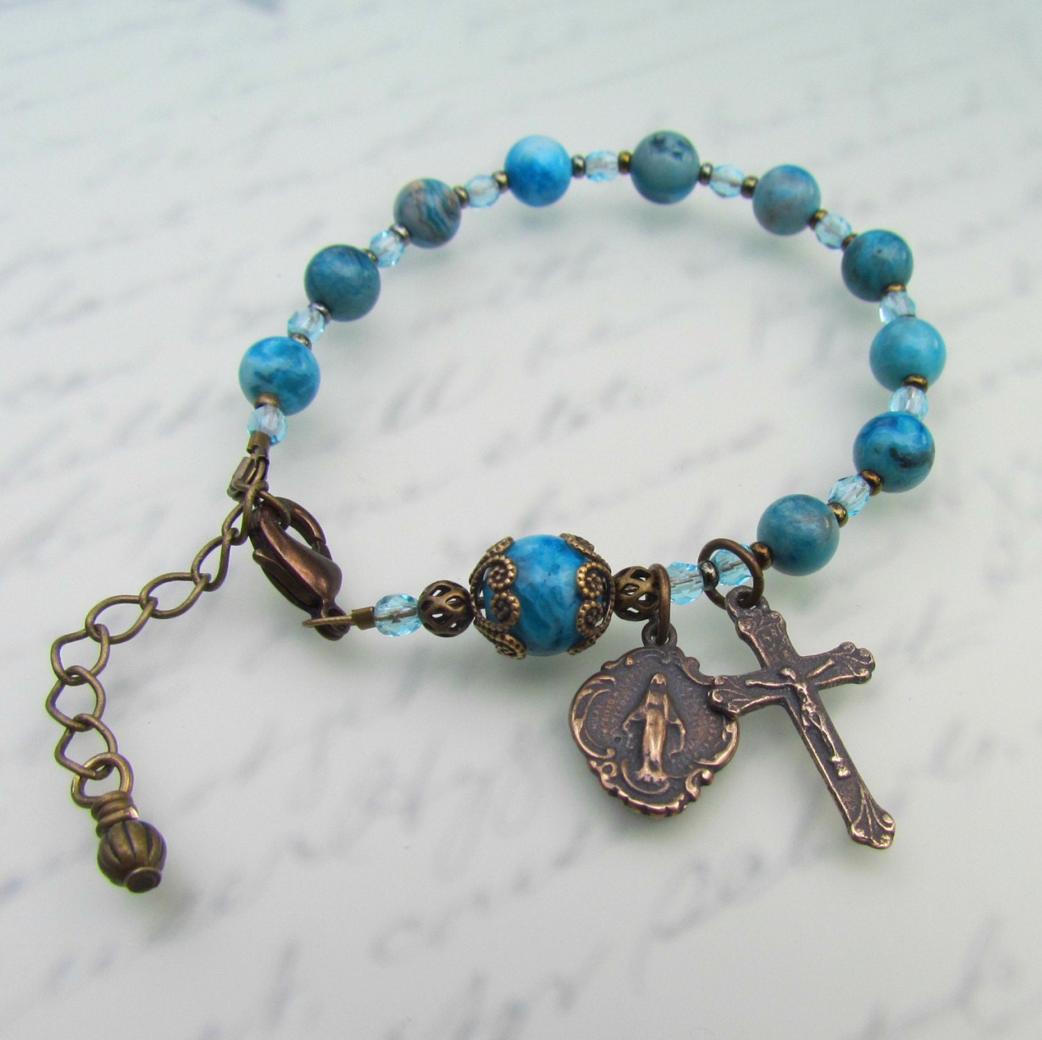 Catholic Rosary Bracelet - Blue Crazy Lace Agate and Bronze cross medals - small size