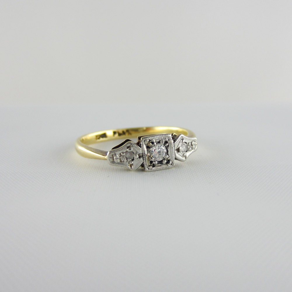 Diamond Engagement Ring. Three Stone Deco Ring in Platinum & Gold, Circa 1920s.