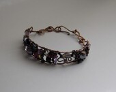 copper wire cuff bracelet with a colorful mix of aubergine beads