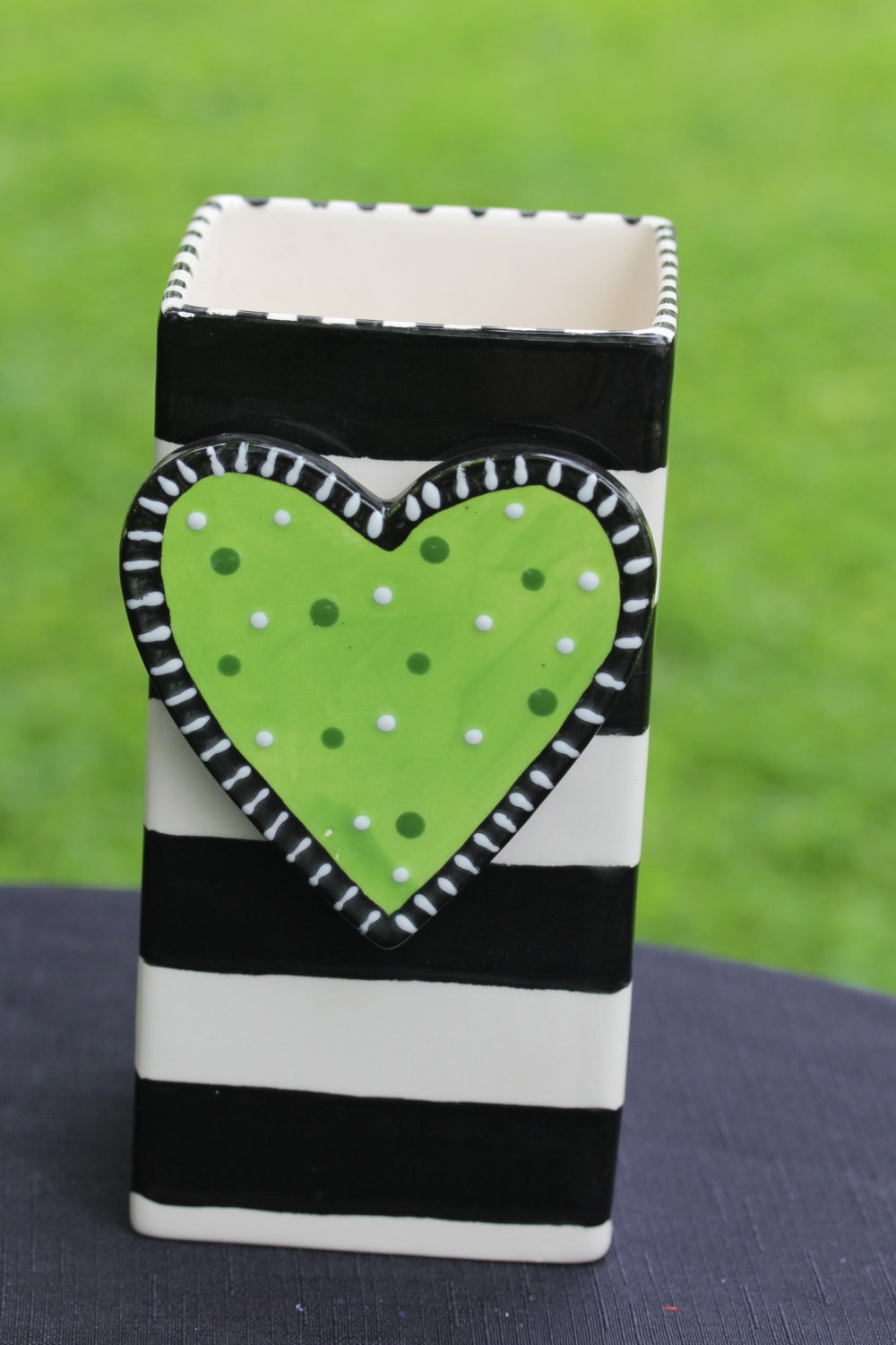 Whimsical vase with changeable charm