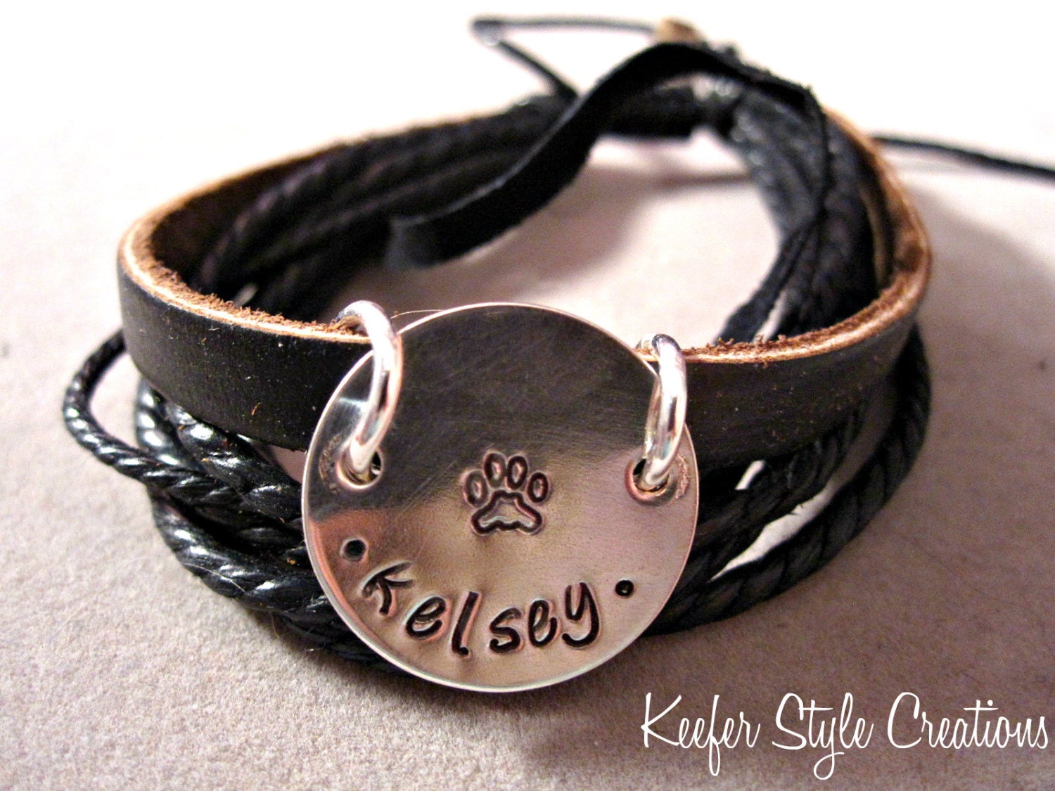Hand Stamped Leather corded bracelet with dog paw print