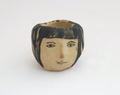 Girl's head ceramic candle holder in brown and black