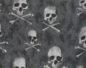 Skulls and Crossbones on a Black and Gray Sparkle Background Out of Print