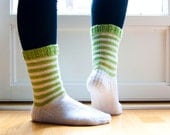 Hand knit white socks with green stripes. Knitted in durable wool blend yarn.