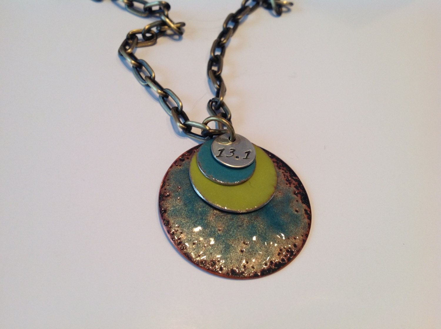 Enameled running necklace copper with ocean blue, green and stamped "run"