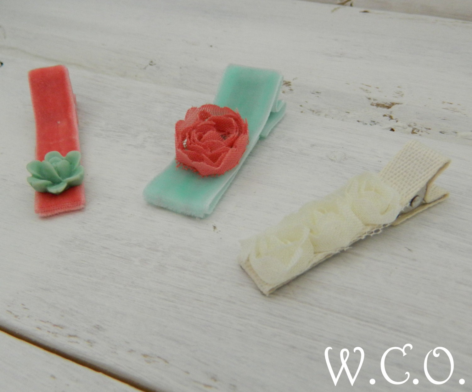 the CLIPPIE Velvety Ribbon Embellished Alligator Clips Set of Three Coral and Aqua