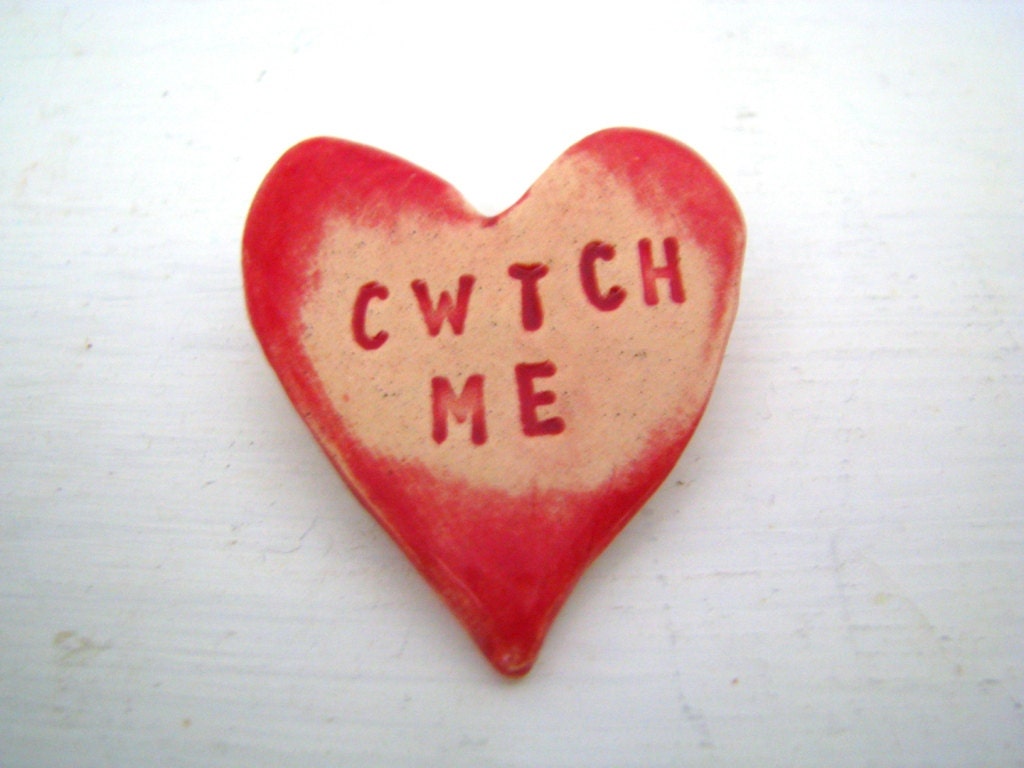 Cwtch Me - Hug me - in Welsh - heart brooch / pin / button / badge. Ceramic. Made in Wales, UK