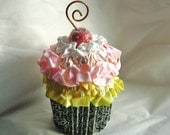 fake cupcake with yellow and pink frosting, copper curlique on top to hold recipes, photos, reminders, gift card holder
