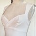 White sweetheart neckline trumpet flair wiggle dress