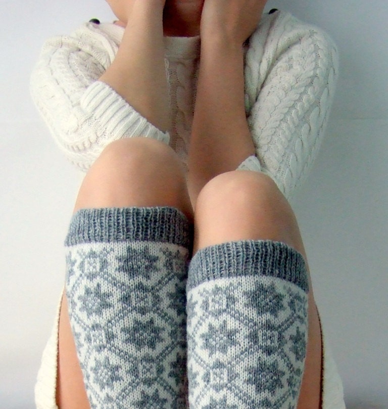 Knit leg warmers made of wool in gray and white color with traditional nordic ornament