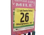 medals displays with race bibs