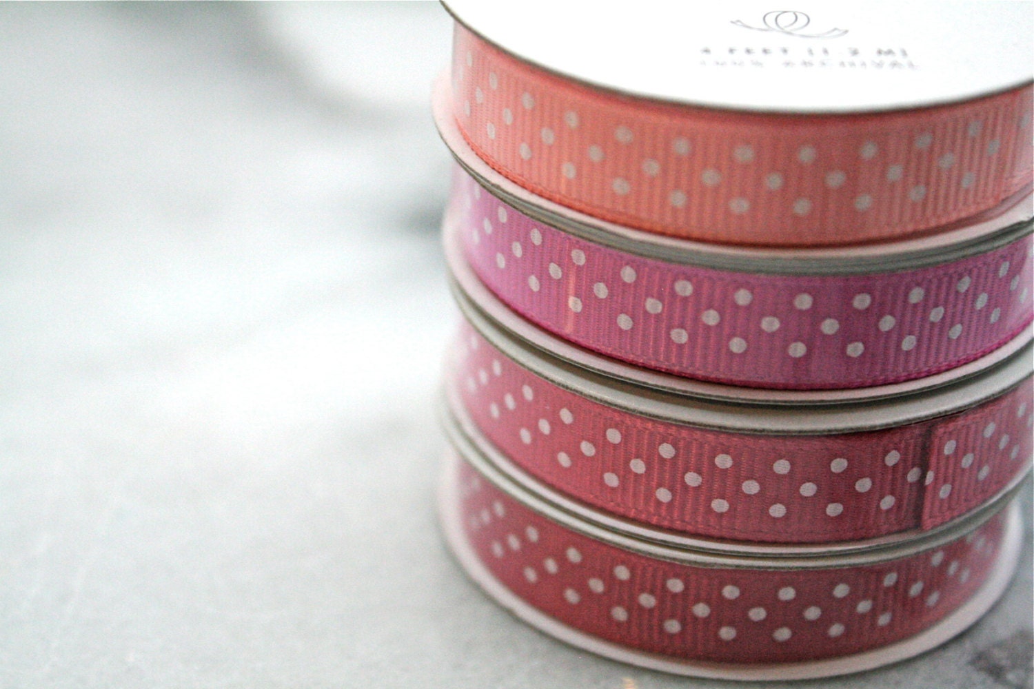 Grosgrain ribbon, pinks and reds.  American Crafts Premium Ribbon, four spools, 4 feet each.  Polka dot craft ribbon.