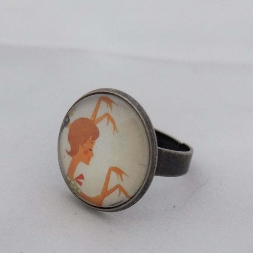 M Adjustable ring with an advertisement for an Olympia typewriter