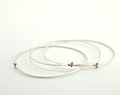 Handmade jewelry. Silver wire bangles. Modern designer fashion bracelet.