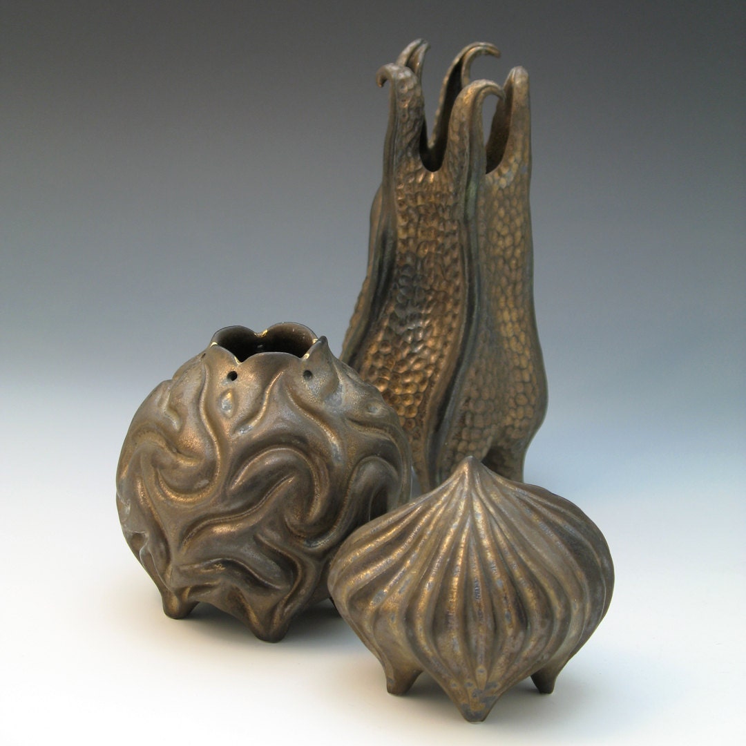 Bronze coral porcelain vessel with gold luster