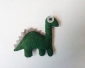 Green dinosaur pin brooch