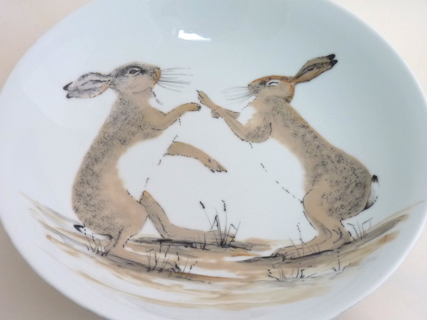 Hand painted bowl, boxing hares painting, lustre overglaze enamels on porcelain