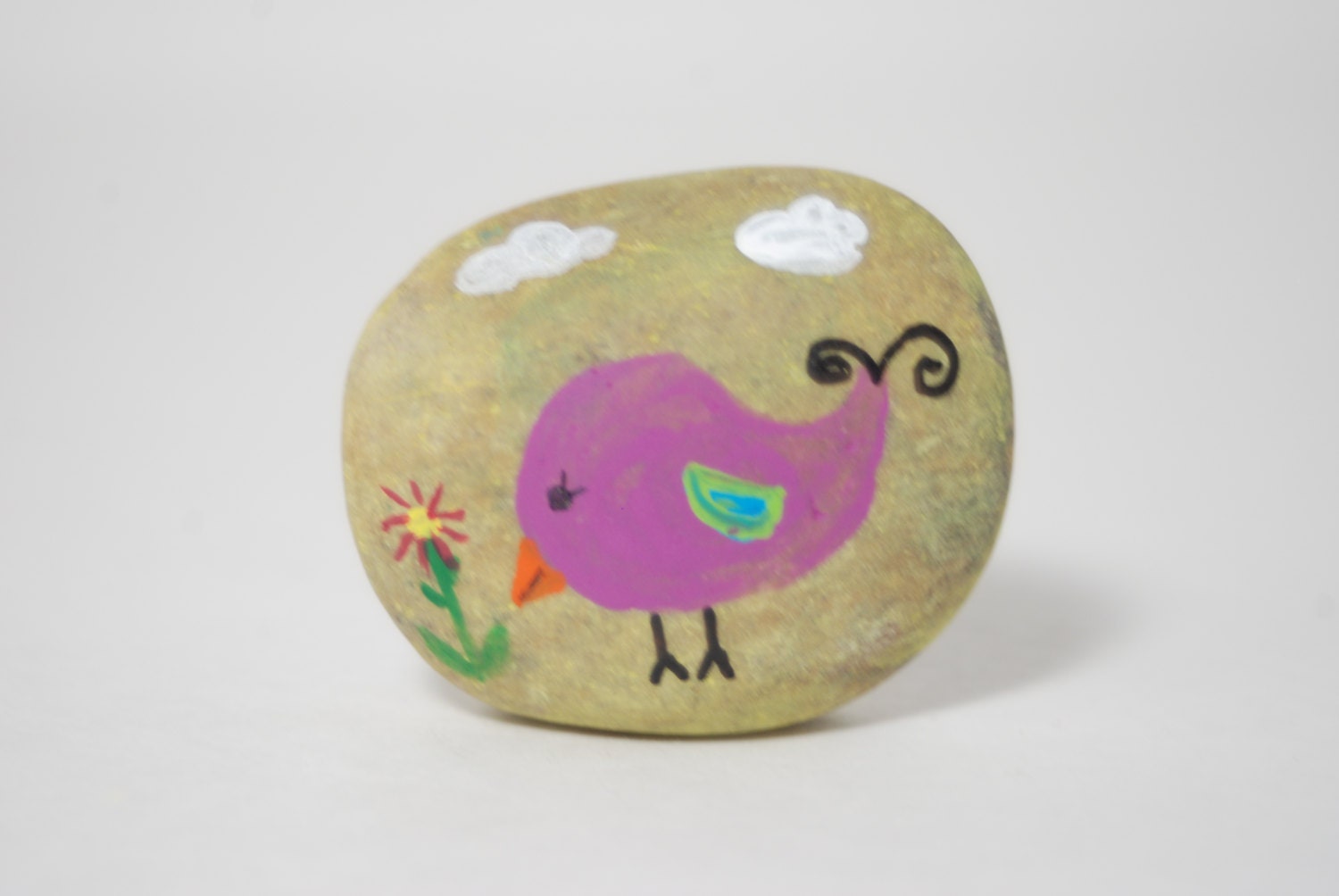 Cute Little Birdie with Flower on a Rock Bird
