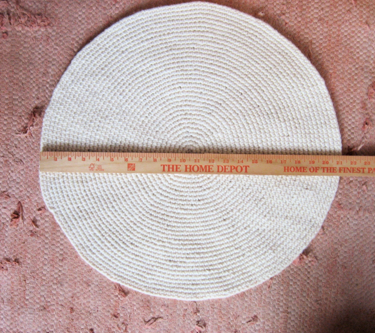 small off-white round wool rug mat