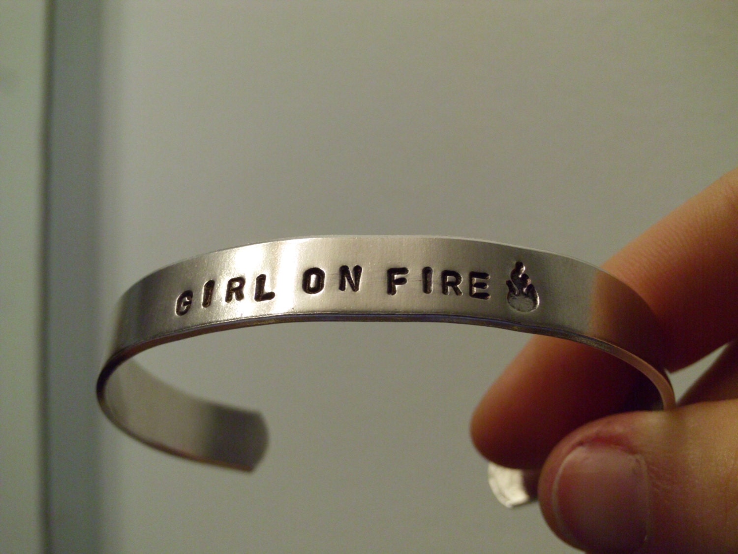 Catching Fire  -  Girl On Fire & Flame Design Stamp Hand Stamped Silver Aluminum Cuff Bracelet -  Geekery