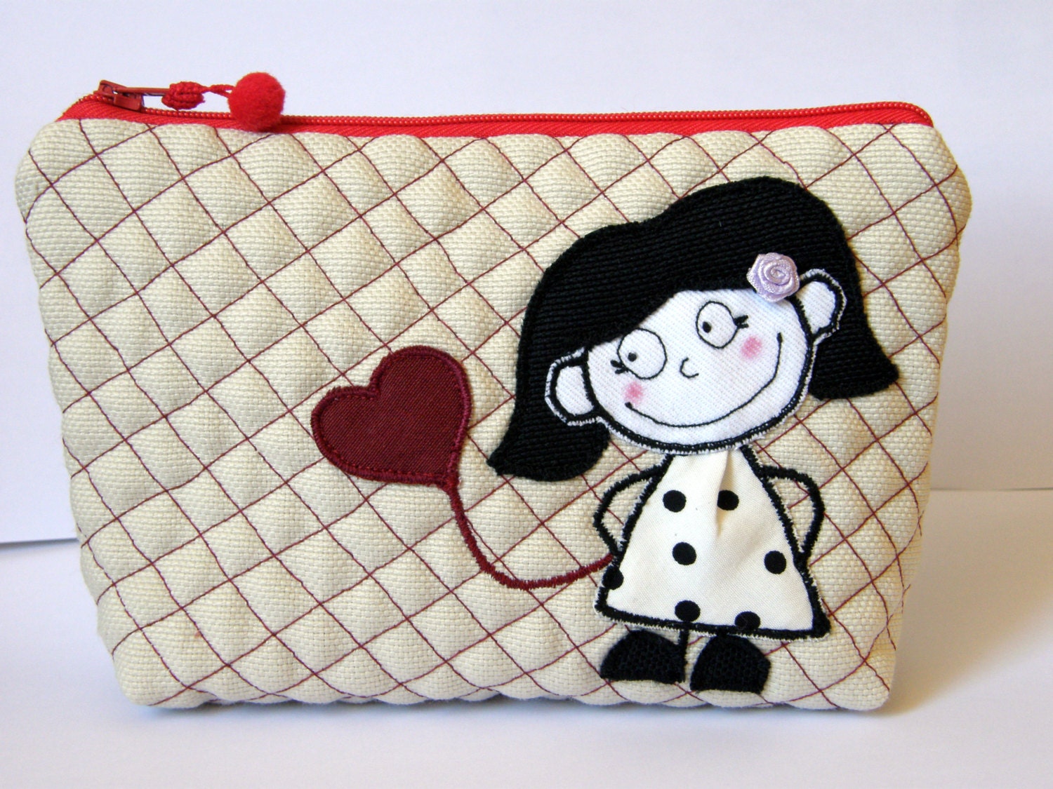 trousse , pochette, cosmetic bag with the application in fabric