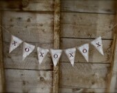Red glittered X's and O's, hugs and kisses, valentine banner, burlap white painted pennants.