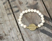 Ivory beaded bracelet with African brass finding