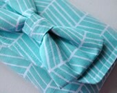 pouch purse wallet: Abstract chevron zig zag shapes print in light blue and white with bow.