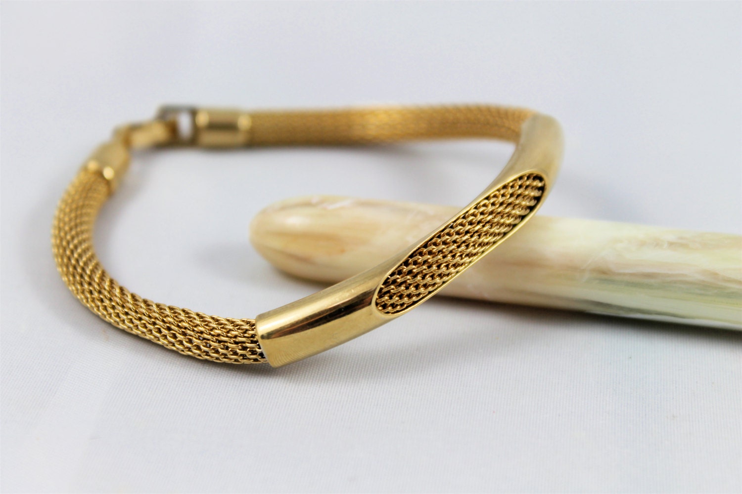 Avon vintage mesh bracelet tubular gold tone signed modern simple clean shiny open tube bead