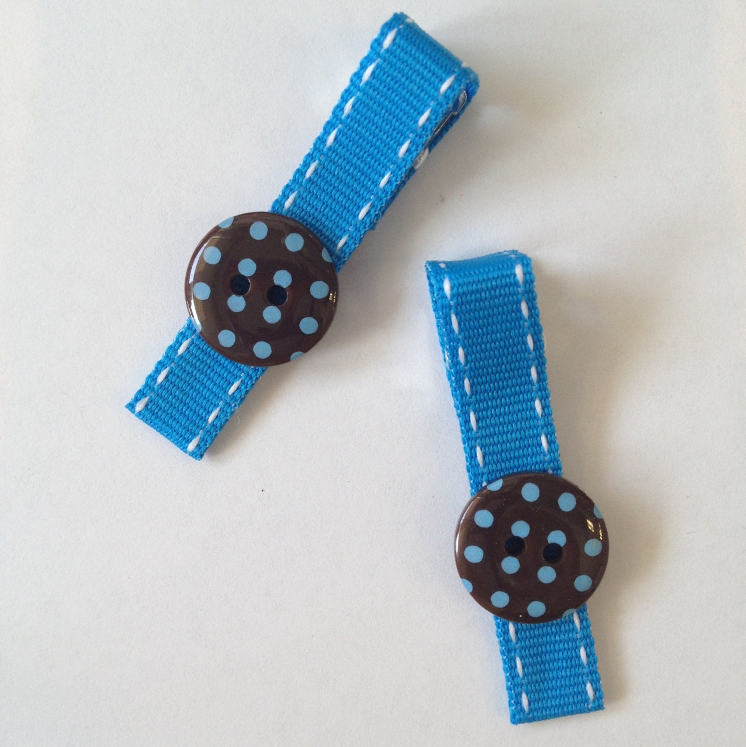 Blue ribbon stitches and brown button hair clip