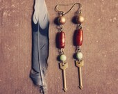 jocelyn.  a pair of bohemian beaded arrow earrings.