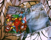 The AVENGERS Studded Acid Wash Light Denim Jean Shorts