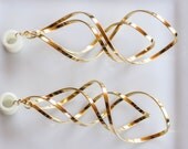 4g-5/8" Gold Spiral Dangle Tunnels