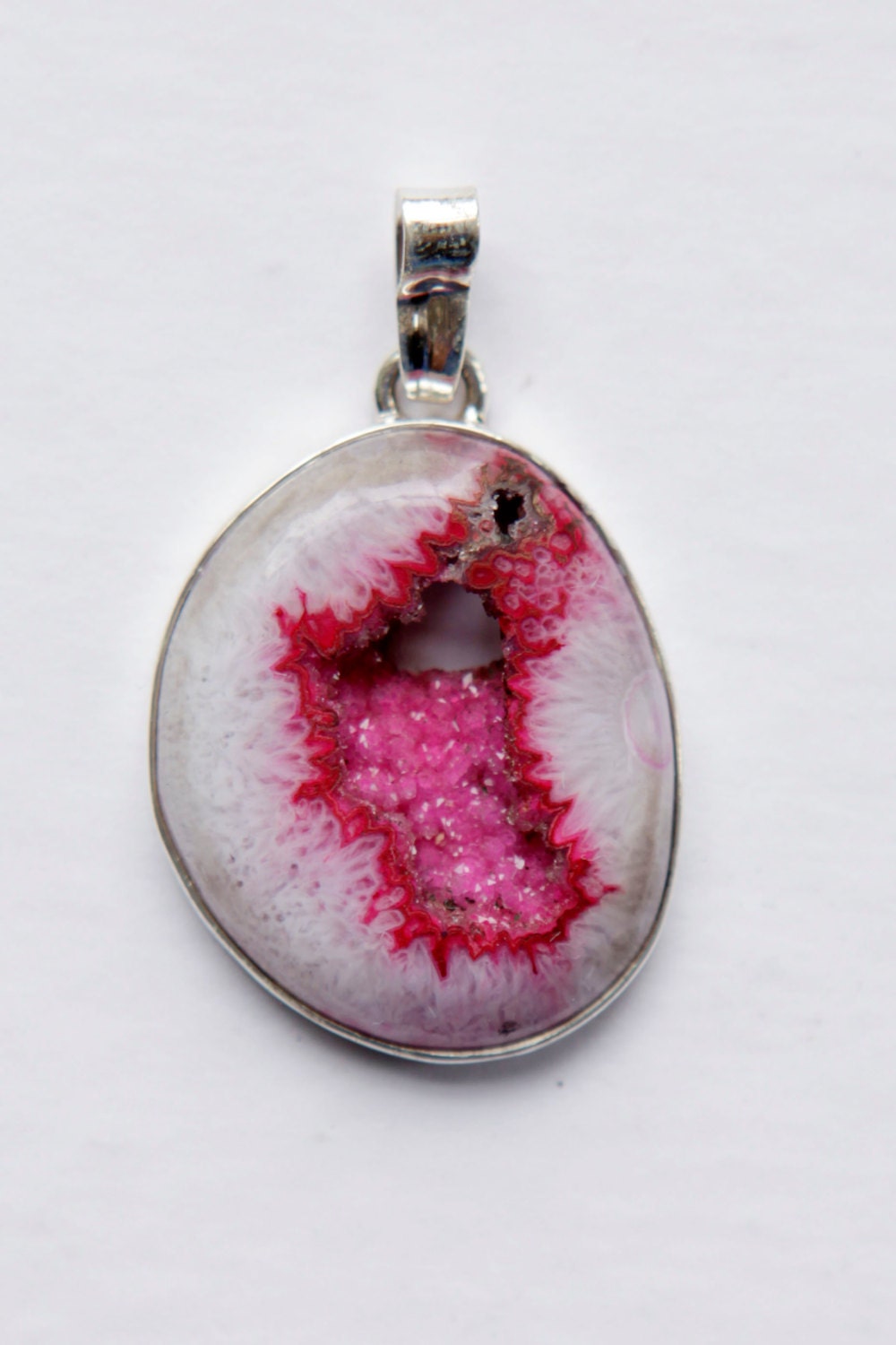 hot pink agate druzy. perfect centerpiece for a hemp necklace, or alone on a chain.